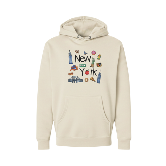 A cream-colored pullover hoodie featuring a colorful graphic print of 'New York' with various iconic landmarks and symbols, displayed on a clean white background.